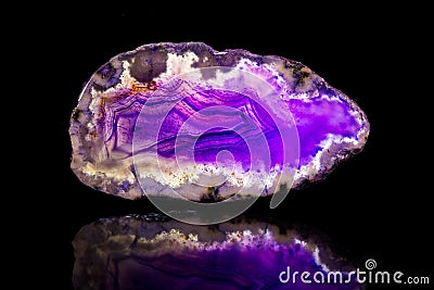 Purple agate slice, black background, healing stone and mineral Stock Photo