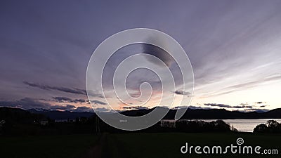 Purple Autumn sunset in Tingvoll fjord in Norway Stock Photo