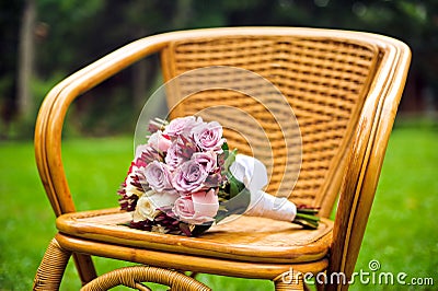 Purple bridal bouquet on a chair Stock Photo
