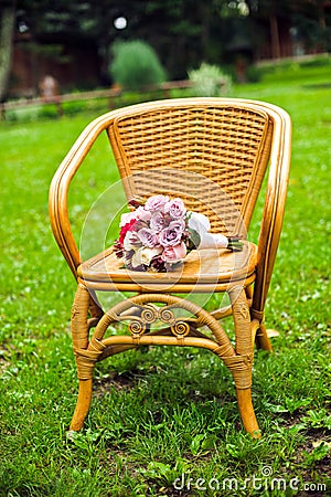 Purple bridal bouquet on a chair Stock Photo