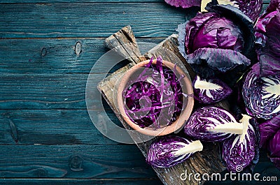 Purple cabbage on a blue wooden background. Organic food. Stock Photo