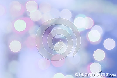 Purple colored Christmas bokeh light abstract holiday background. Stock Photo