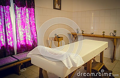 Massage table in the massage room Stock Photo