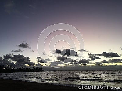 Purple Dawn in Wailua Bay in September on Kauai Island, Hawaii. Stock Photo