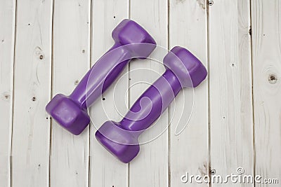 Purple dumbbells on the floor Stock Photo