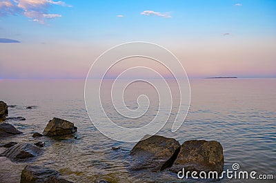 Purple Dusk. Beautiful clouds over the calm sea. Pink sunset on the sea Stock Photo