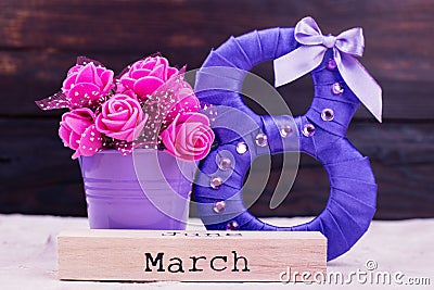 Purple eight, flowers, word March. Stock Photo