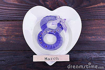 Purple eight, word March on plate Stock Photo