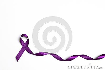 Purple epilepsy awareness ribbon on a white background with copy space Stock Photo