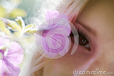 Purple flower and brown eye Stock Photo