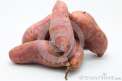 Purple fresh sweet potato on white Stock Photo