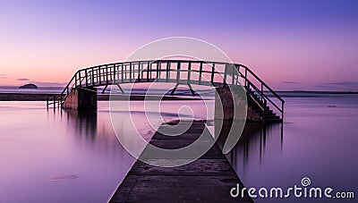 Purple glow on Bridge to Nowhere Stock Photo