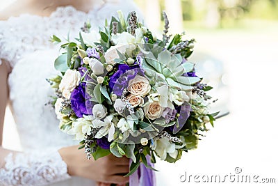 Purple green succulent flower wedding bouquet Stock Photo