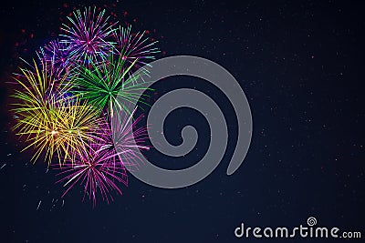 Purple green yellow blue fireworks copy space Stock Photo