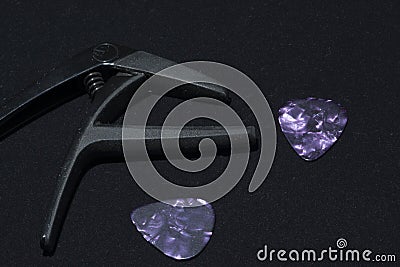 Guitar picks and capo Stock Photo