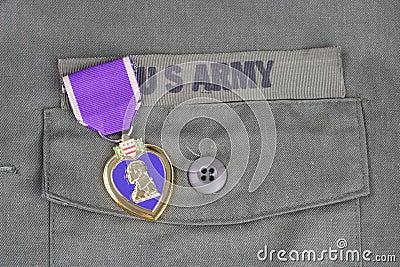 Purple Heart award on US ARMY olive green uniform Stock Photo