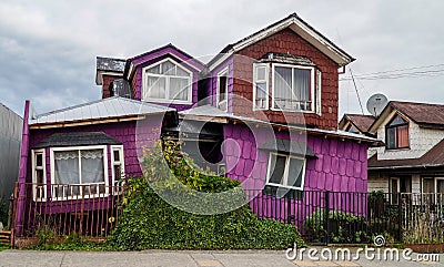 Purple house in Chiloe, Chile. Stock Photo