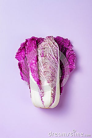 Purple napa cabbage on pastel color background. Minimal concept. Plant based vegan or vegetarian cooking. Clean eating food Stock Photo