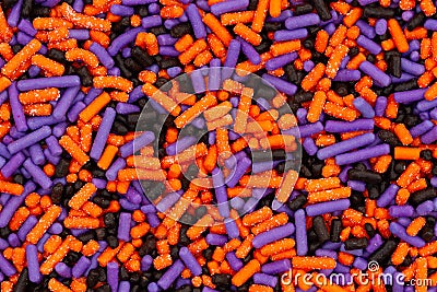 Purple, orange and black candy closeup background Stock Photo