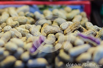 Purple peanut for sale at the fresh market. The peanut, also known as the groundnut and the goober. Stock Photo