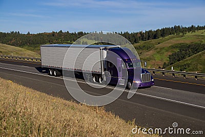 Purple Peterbilt Semi-Truck / White Trailer Stock Photo