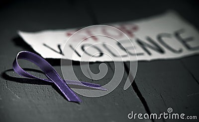 Purple ribbon against the violence against women Stock Photo