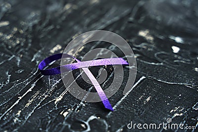 Purple ribbon-symbol of the fight against domestic violence Stock Photo