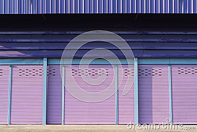 Purple roller shutter doors closed. Stock Photo