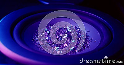 Purple sequence beads tremble and jump on speaker close view Stock Photo