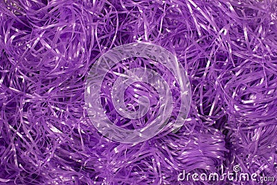Purple shredded plastic fake Easter grass background Stock Photo