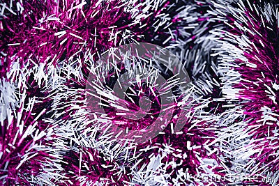 Purple tinsel texture. Festive garland. New Year and Christmas concept. Stock Photo