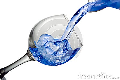 Purple water pours into a glass on a white background Stock Photo