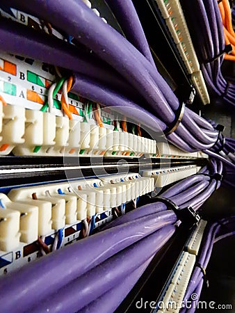 Purple wires running into a patching array Stock Photo