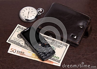 Purse money hours mobile phone Stock Photo