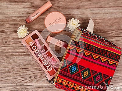 A pouch (bag) of item, especially to save some makeup or a pile of money Editorial Stock Photo