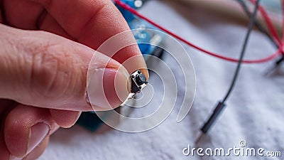 Push button component used in microcontroller builds Stock Photo