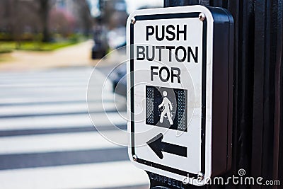 Push button to cross road crosswalk sign Stock Photo