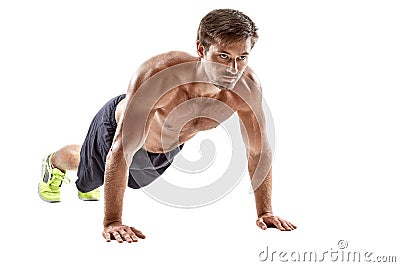 Push up fitness man doing push-up bodyweight exercise on gym floor. Athlete working out chest muscles strength training Stock Photo