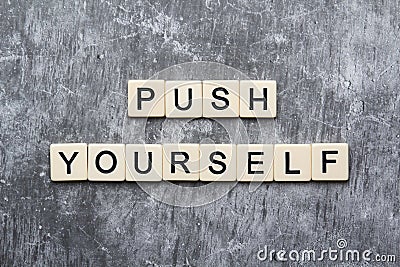 Push yourself motivation formed with plastic tiles Stock Photo