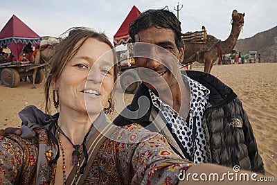 European tourist taking selfie with Indian friend Editorial Stock Photo