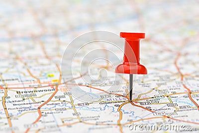 Pushpin marking location on map Stock Photo