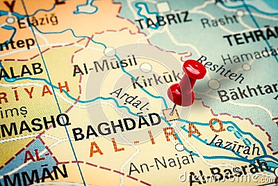 Pushpin pointing at Baghdad city in Iraq Stock Photo