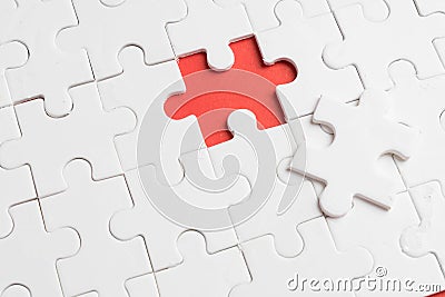 put the last piece of jigsaw puzzle to complete the mission Stock Photo