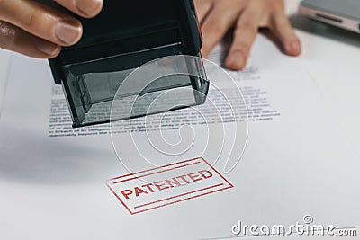 Patented stamp on document. intellectual property protection Stock Photo