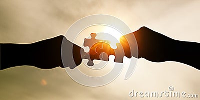 Put together two jigsaw puzzle pieces Stock Photo