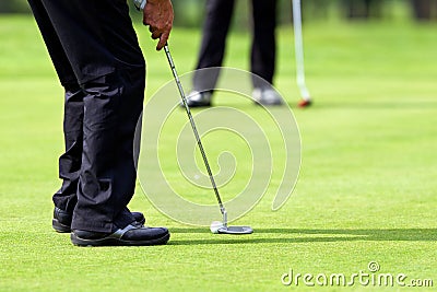 Putt on golf green Stock Photo