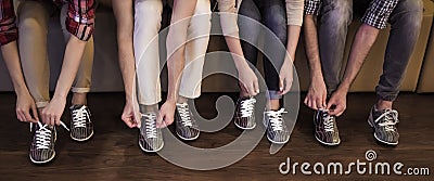 Putting on bowling shoes Stock Photo