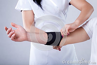 Putting on compression band Stock Photo