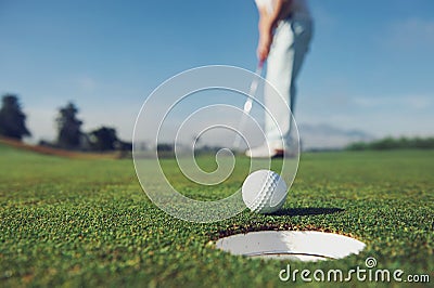 Putting golf man Stock Photo