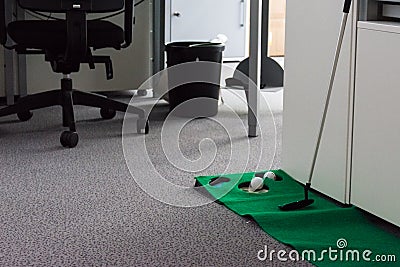 Putting Green in Modern White Office Corporate Fun Entertainment Stock Photo